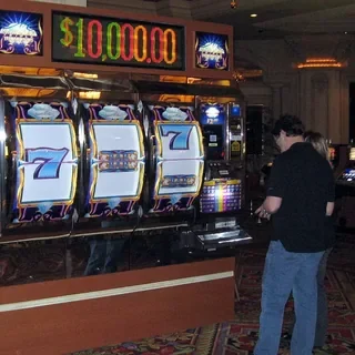 Player at a slot machine showing a jackpot