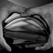Hands shuffling a deck of cards